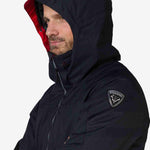 Rossignol All Speed Insulated Jacket 2022-2023 - A black jacket with a red zipper and a white logo on the left sleeve.
