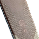 Rossignol Experience 82 Skis with X11 Bindings 2023 - A pair of skis with a subtle, textured pattern on their surface and a light-colored finish.
