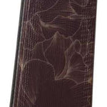 Rossignol Ladies Experience 86 Basalt Ski 2023 - A dark brown ski with a subtle floral pattern and a circular logo on the top.