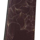 Rossignol Ladies Experience 86 Basalt Ski 2023 - A dark brown ski with a subtle floral pattern and a circular logo on the top.