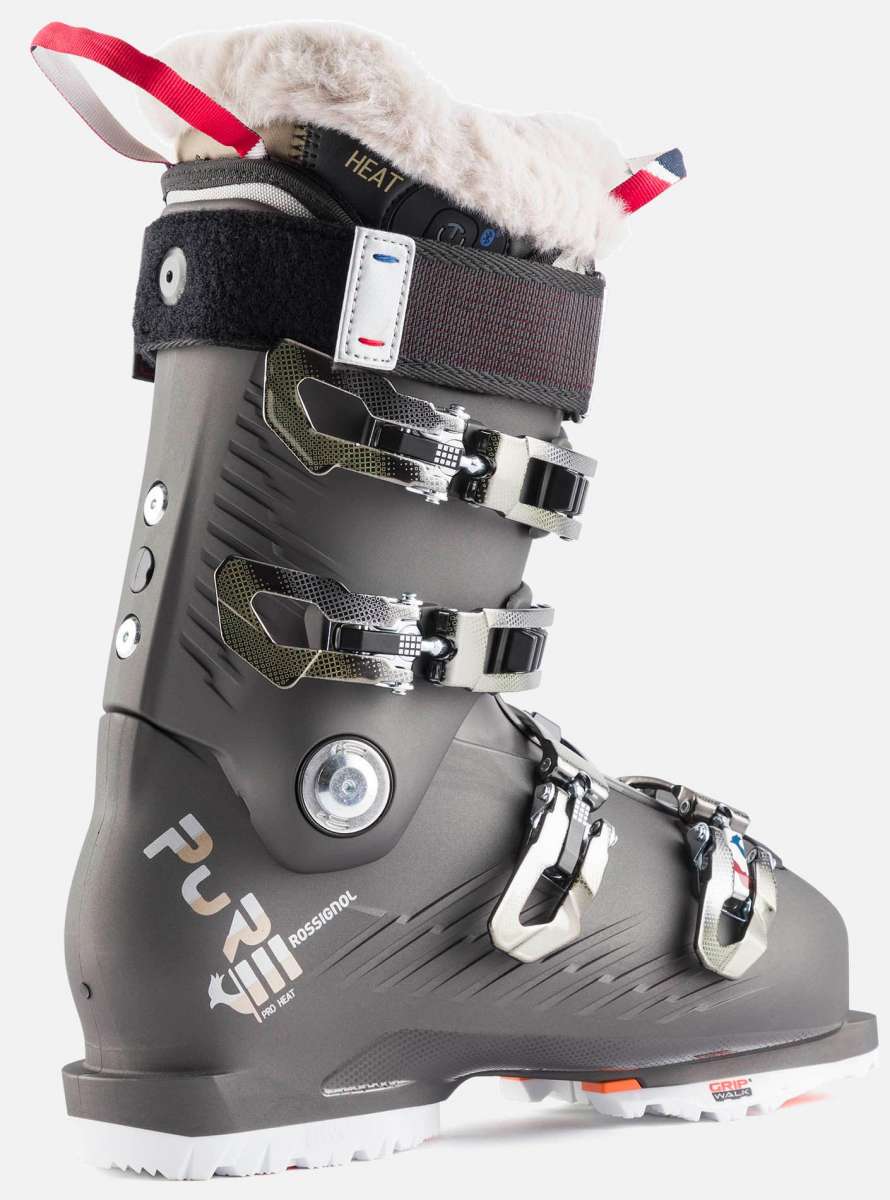 Rossignol Women's Pure Pro Heat 100 Ski Boots 2023 - Black ski boots with a white fur trim on top of the tongue and heel.