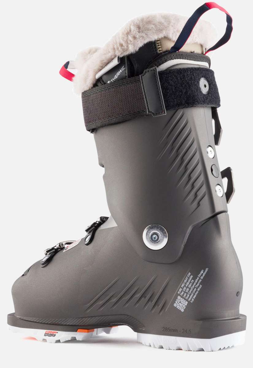 Rossignol Women's Pure Pro Heat 100 Ski Boots 2023 - Black ski boots with white fur lining at top and silver buckles.