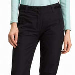 Rossignol Ladies Rapide Insulated Pant 2022-2023 - Black insulated ski pants with a zippered pocket on the side of one leg.