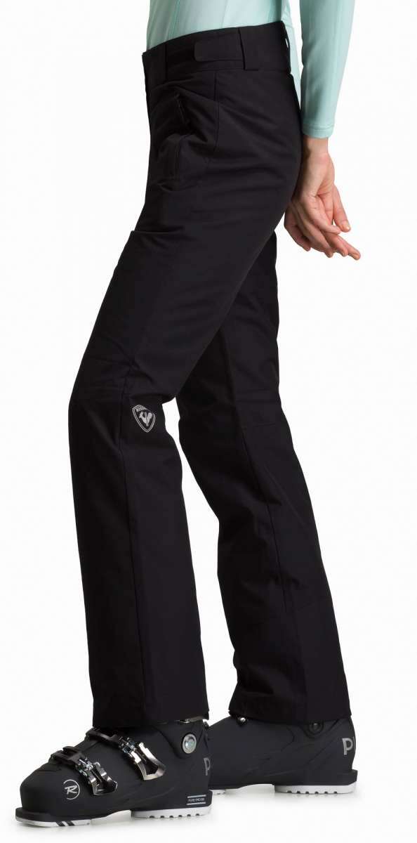 Rossignol Ladies Rapide Insulated Pant 2022-2023 - Black ski pants with a white logo on the left leg and silver buckles on the waistband.