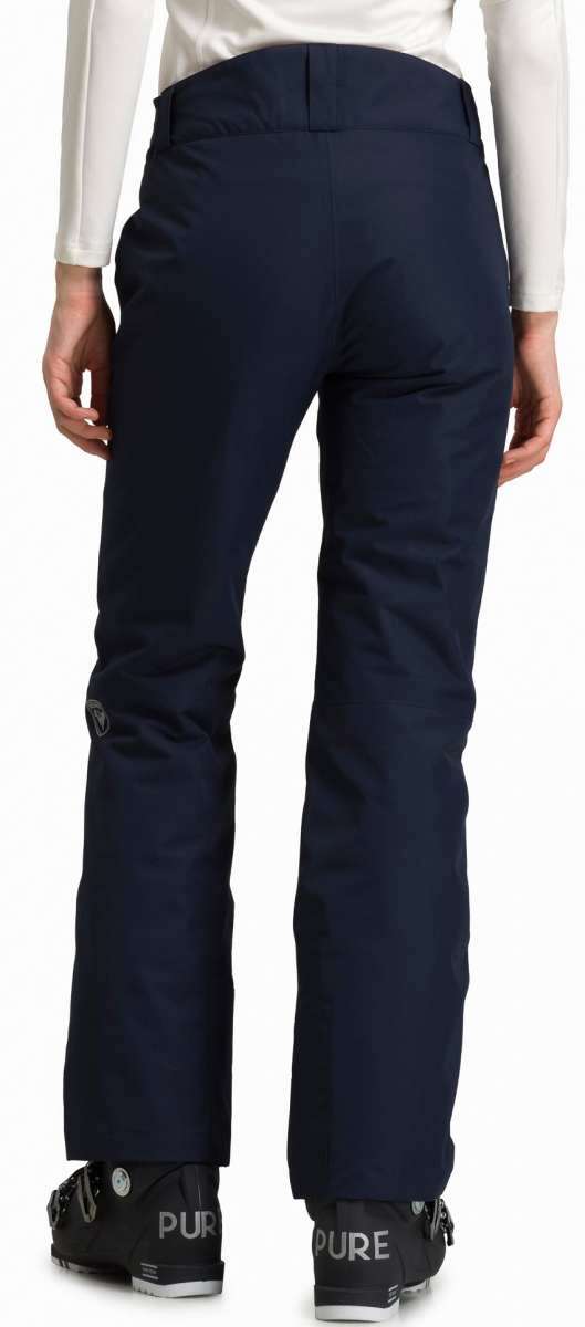 Rossignol Ladies Rapide Insulated Pant 2022-2023 - A pair of dark blue ski pants with a black logo on the left thigh and silver buckles at the waist.