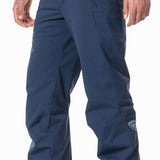 Rossignol Siz Insulated Pant 2024 - A pair of navy blue snow pants with a zippered pocket on the side and a logo patch near the bottom hem.