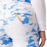 Roxy Women's Chloe Kim Insulated Pants 2024 - White snowboard pants with a blue and white abstract pattern of clouds and lines.