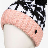 Roxy Junior's Amara Beanie 2023 - A black and white fair isle patterned beanie with a pink brim and pom-pom on top.