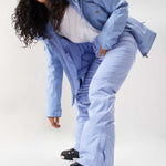 Roxy Junior's Backyard Insulated Pant 2024 - Light blue snow pants with a subtle white stripe pattern on the side of each leg.