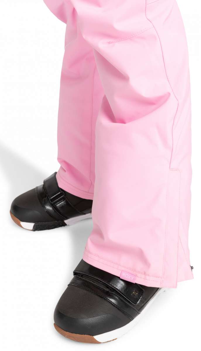 Roxy Junior's Backyard Insulated Pant 2024 - A pair of pink snow pants with a zippered pocket on the side and adjustable velcro straps at the waist.