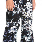 Roxy Junior's Backyard Printed Pant 2023 - Black snow pants with a white floral pattern and blue accents.