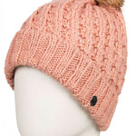 Roxy Junior's Blizzard Beanie 2023 - A pink beanie with a brown faux fur pom-pom on top.