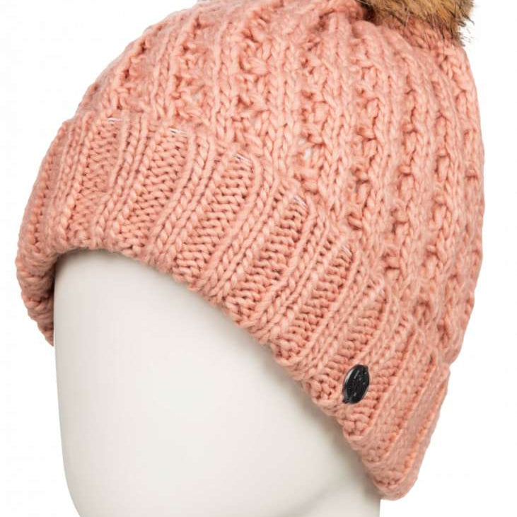 Roxy Junior's Blizzard Beanie 2023 - A pink beanie with a brown faux fur pom-pom on top.