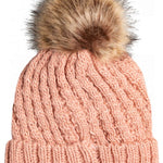 Roxy Junior's Blizzard Beanie 2023 - A light pink beanie with a cable-knit pattern and a large, fluffy brown faux fur pom-pom on top.
