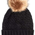 Roxy Junior's Blizzard Beanie 2024 - A black beanie with a large, fluffy tan-colored pom-pom on top.