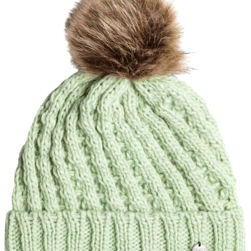 Roxy Junior's Blizzard Beanie 2024 - A mint green beanie with a brown faux fur pom-pom on top.