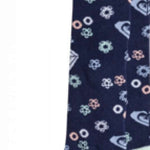 Roxy Junior's Frosty Sock 2023 - A pair of navy blue socks with a repeating pattern of white snowflakes and pink accents.