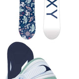 Roxy Junior's Poppy Snowboard Package 2024 - A blue snowboard with a pattern of white animals and flowers, including a pink fox, on a dark background.
