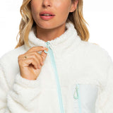 Roxy Women's Alabama Full Zip Jacket 2023 - A white fleece jacket with a zippered front and two pockets on either side, worn by a model against a light gray background.