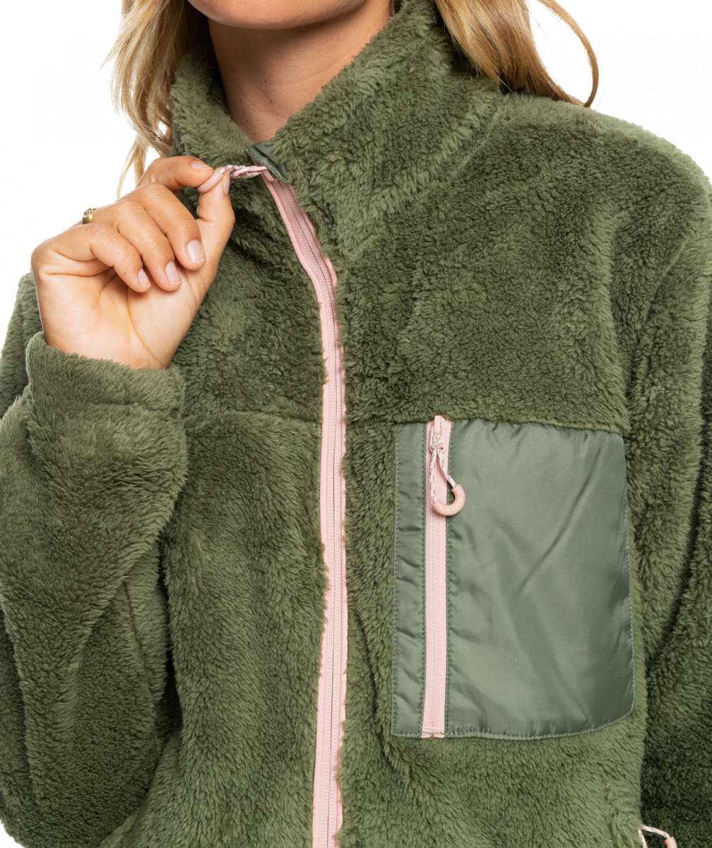 Roxy Women's Alabama Full Zip Jacket 2023 - A green fleece jacket with a zippered front and two pockets on either side, worn by a model against a white background.