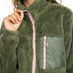 Roxy Women's Alabama Full Zip Jacket 2023 - A green fleece jacket with a zippered front and two pockets on either side, worn by a model against a white background.