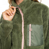 Roxy Women's Alabama Full Zip Jacket 2023 - A green fleece jacket with a zippered front and two pockets on either side, worn by a model against a white background.
