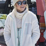 Roxy Women's Alabama Full Zip Jacket 2023 - A cream-colored jacket with a zippered front and two pockets on either side, worn by a model in front of a snowy background.