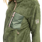 Roxy Women's Alabama Full Zip Jacket 2023 - A green fleece jacket with a zippered front and two pockets on either side, worn by a model in a studio setting.