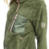 Roxy Women's Alabama Full Zip Jacket 2023 - A green fleece jacket with a zippered front and two pockets on either side, worn by a model in a studio setting.
