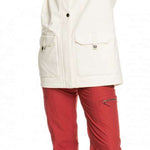 Roxy Women's Andie Insulated Jacket - A cream-colored jacket with a hood, worn by a model who has both hands raised to her head.