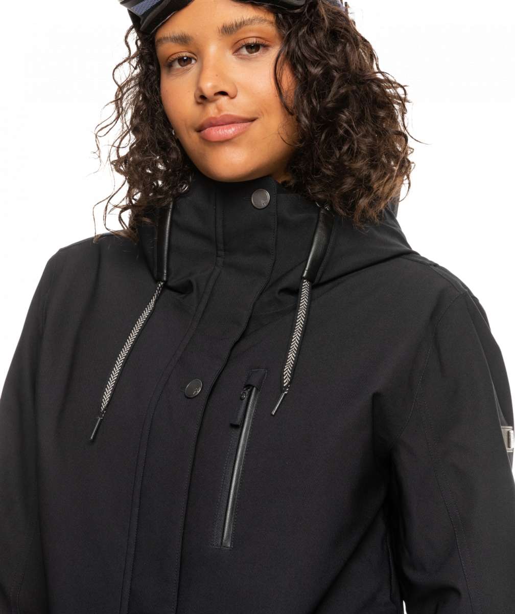 Roxy Women's Andie Insulated Jacket 2023 - A black jacket with a high collar and zippered pockets, featuring a small white logo on the left sleeve.