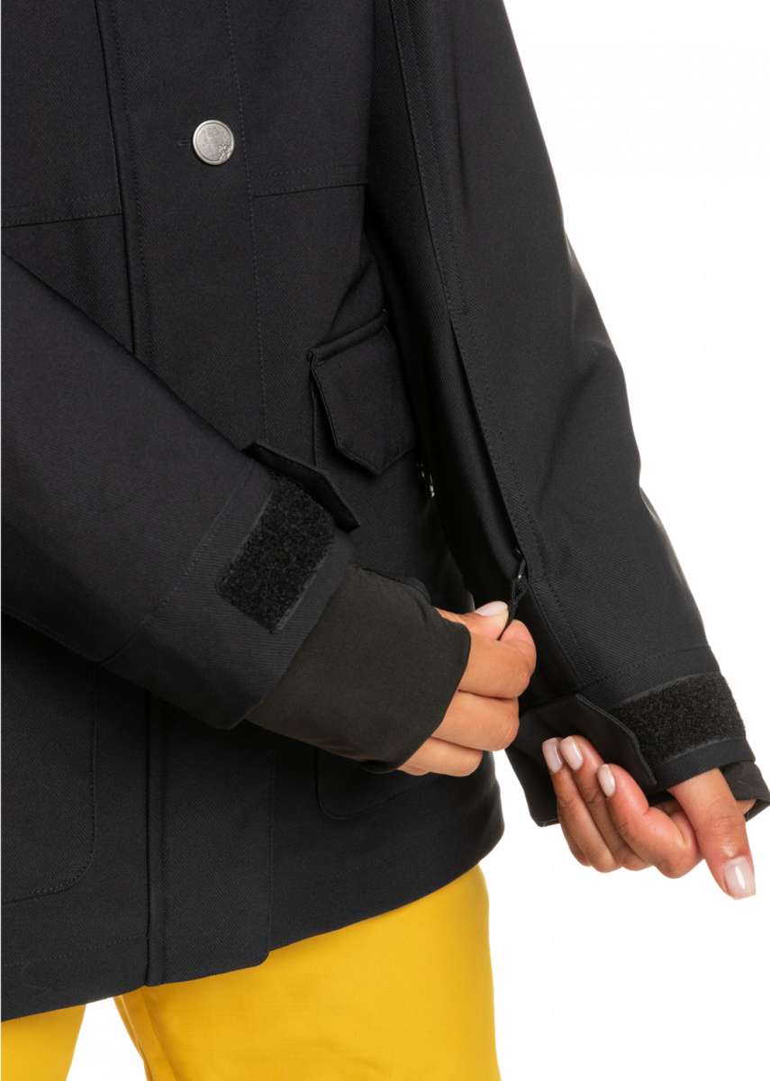 Roxy Women's Andie Insulated Jacket - A black jacket with a silver button on the chest and two pockets on the front, one of which has a flap.