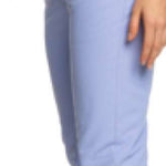 Roxy Women's Backyard Insulated Pant 2023 - A pair of light blue snow pants with a subtle pattern on the left thigh, featuring two zippered pockets and a belt loop at the waist.