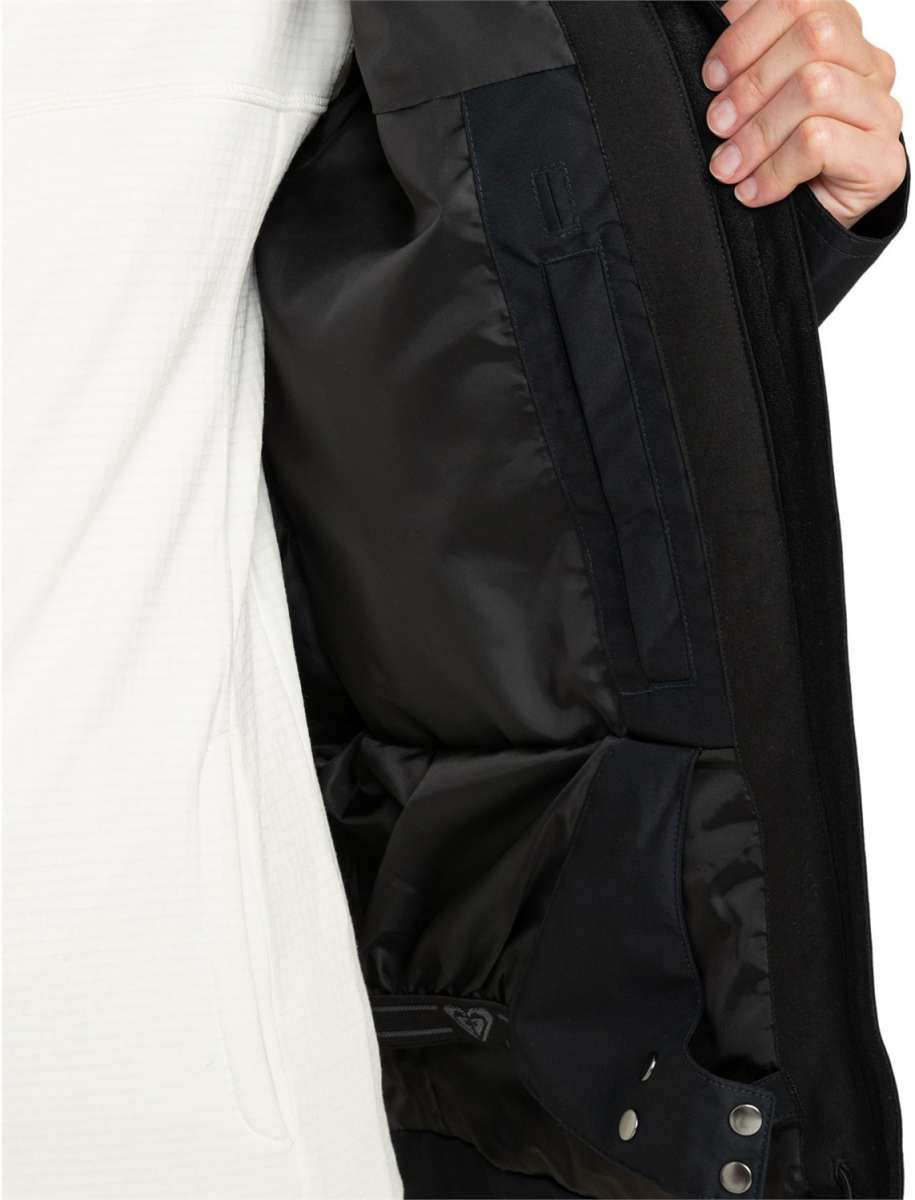 Roxy Women's Billie Insulated Jacket 2024 - A black insulated jacket with a zippered front and two pockets on either side, worn by a model in an angled view from the right side.