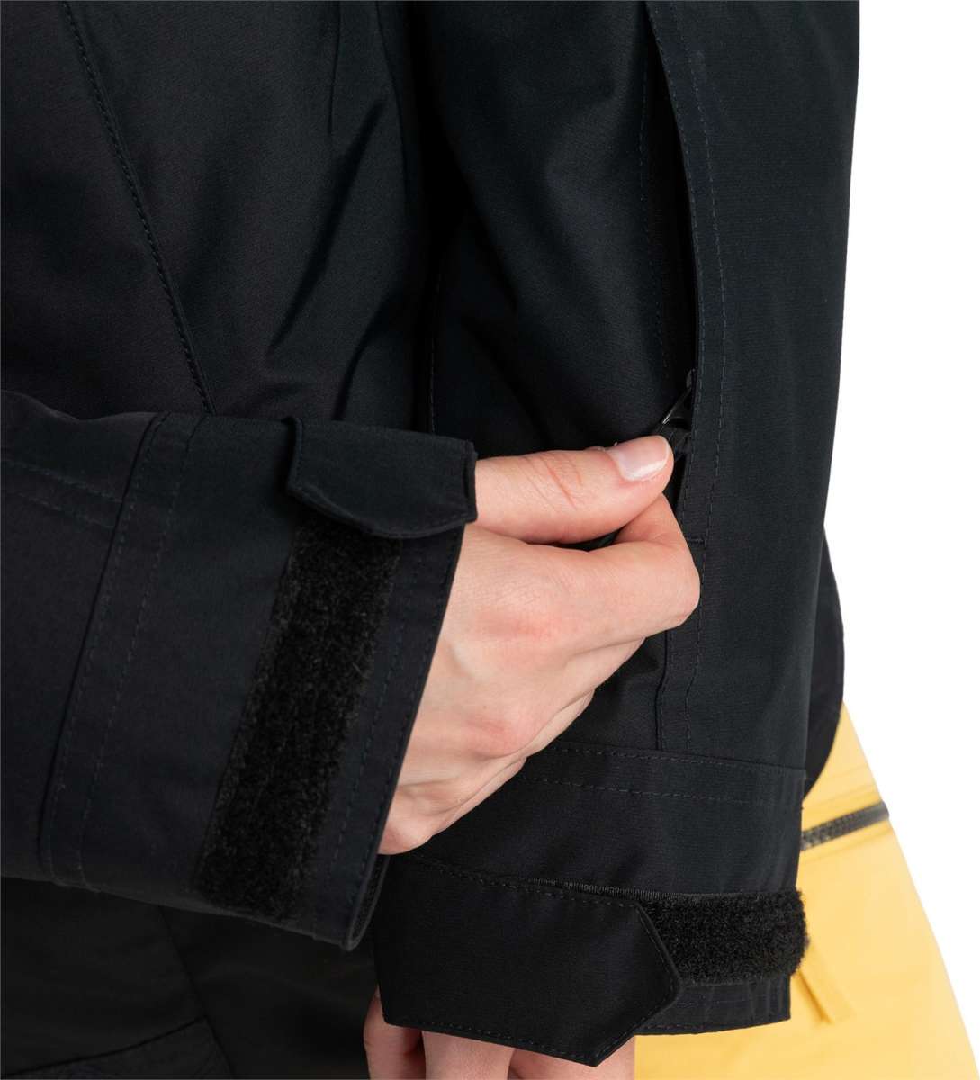 Roxy Women's Billie Insulated Jacket 2024 - A black insulated jacket with a zippered chest pocket and adjustable cuffs.