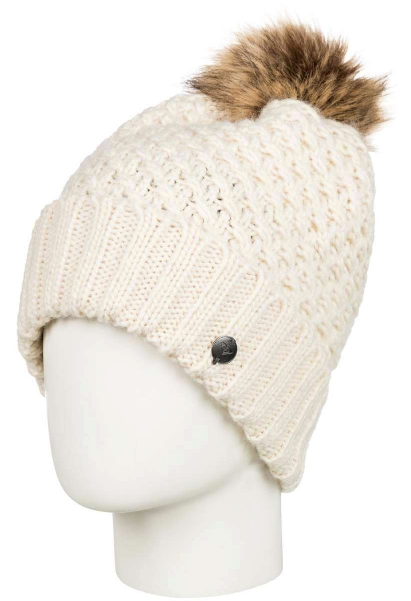 Roxy Women's Blizzard Beanie 2022 - A cream-colored beanie with a cable-knit pattern and a brown faux fur pom-pom on top.