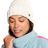 Roxy Women's Blizzard Beanie - A cream-colored beanie with a brown faux fur pom-pom on top.