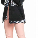 Roxy Women's Blizzard Beanie - A mint green beanie with a brown pom-pom on top.