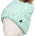 Roxy Women's Blizzard Beanie 2023 - A mint green beanie with a brown faux fur pom-pom on top.