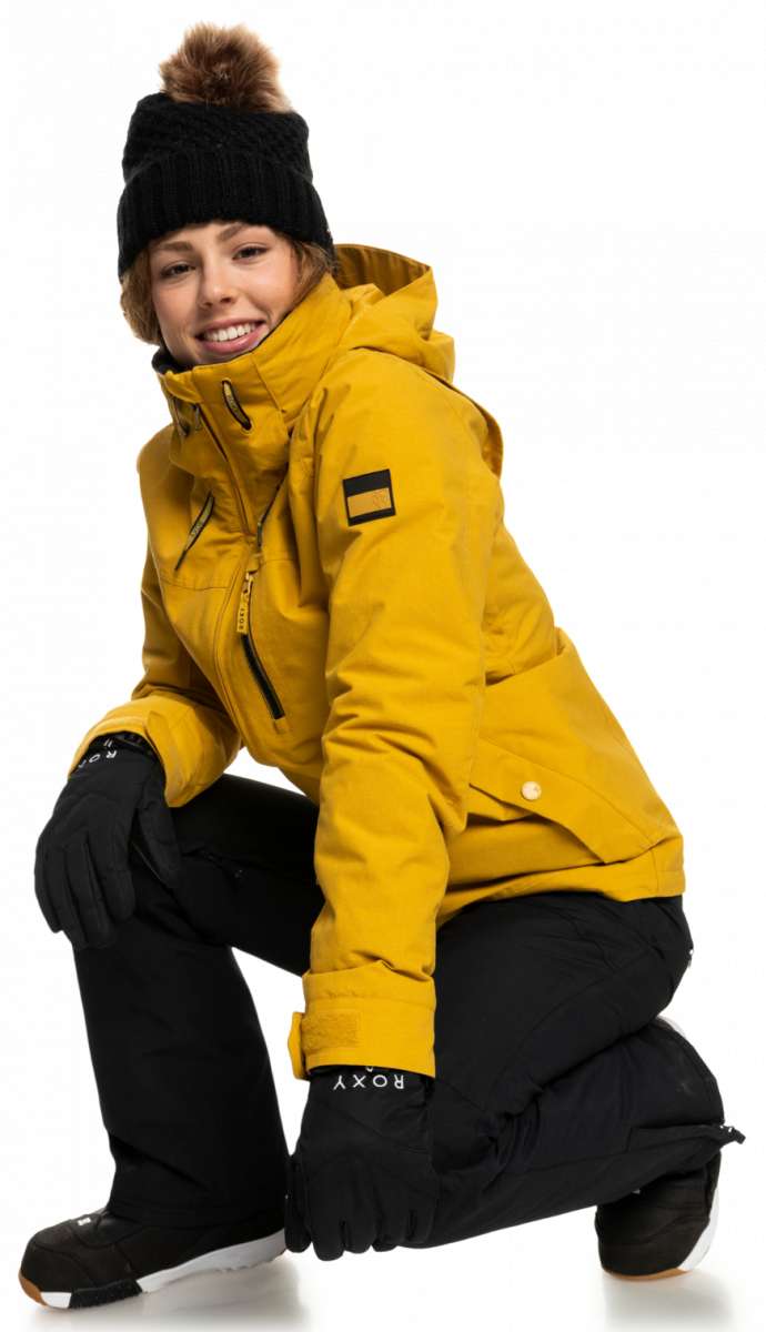 Roxy Women's Blizzard Beanie - A black beanie with a brown faux fur pom-pom on top.