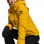 Roxy Women's Blizzard Beanie - A black beanie with a brown faux fur pom-pom on top.