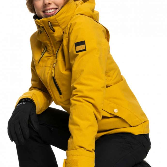 Roxy Women's Blizzard Beanie - A black beanie with a brown faux fur pom-pom on top.