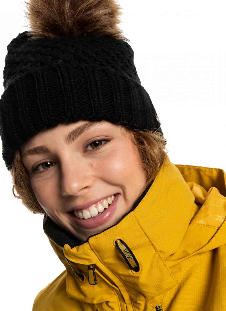 Roxy Women's Blizzard Beanie 2023 - A black knit beanie with a brown faux fur pom-pom on top.