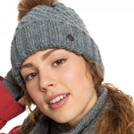 Roxy Women's Blizzard Beanie 2023 - A gray beanie with a brown faux fur pom-pom on top.