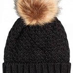 Roxy Women's Blizzard Beanie 2023 - A black beanie with a large, fluffy tan-colored faux fur pom-pom on top.
