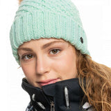 Roxy Women's Blizzard Beanie 2023 - A mint green beanie with a brown faux fur pom-pom on top.