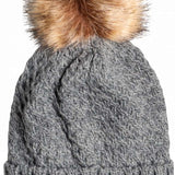 Roxy Women's Blizzard Beanie 2023 - A gray beanie with a large, fluffy brown faux fur pom-pom on top.
