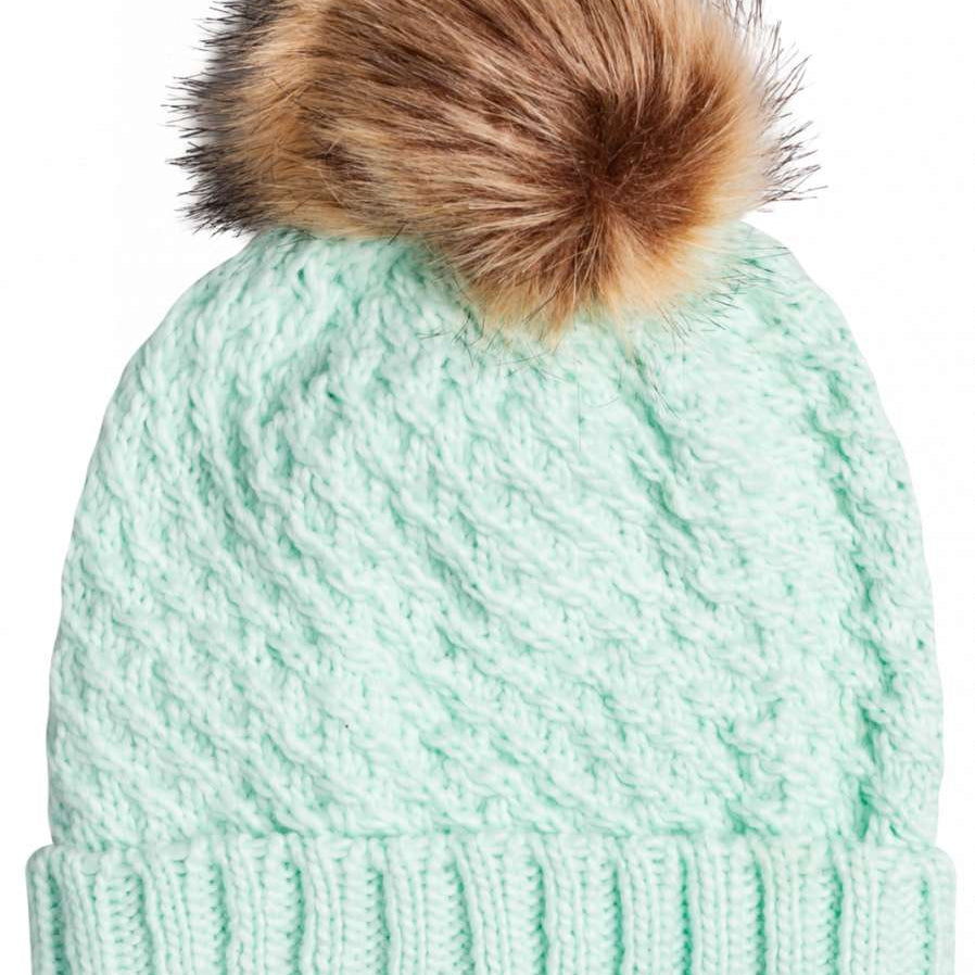 Roxy Women's Blizzard Beanie 2023 - A mint green beanie with a brown faux fur pom-pom on top.