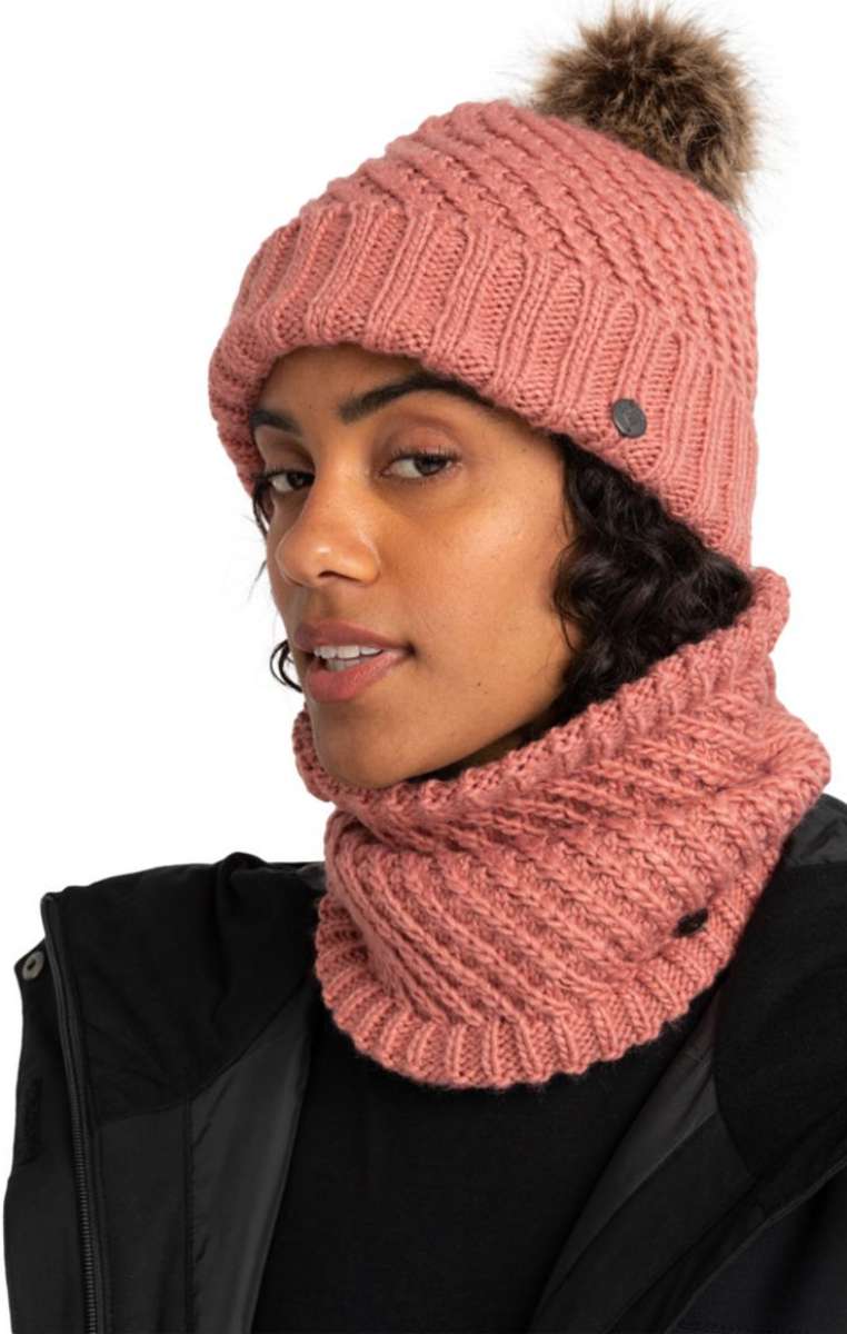 Roxy Women's Blizzard Beanie - A dusty rose-colored beanie with a ribbed pattern and a brown faux fur pom-pom on top.