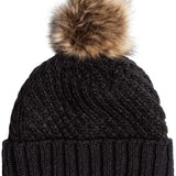 Roxy Women's Blizzard Beanie 2024 - A black beanie with a large, fluffy brown faux fur pom-pom on top.